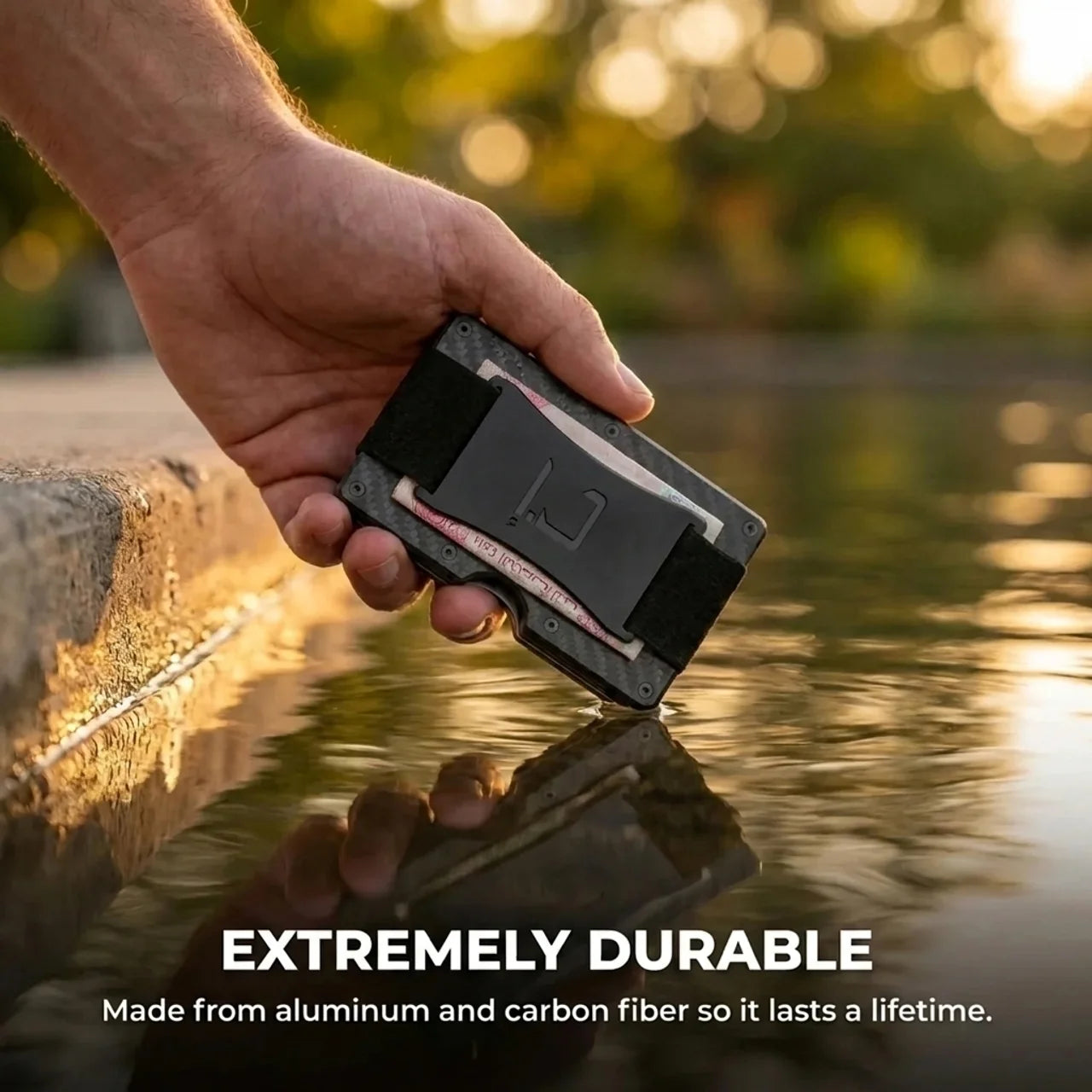 Zade carbon fiber wallet held above water showing durability and lifetime build